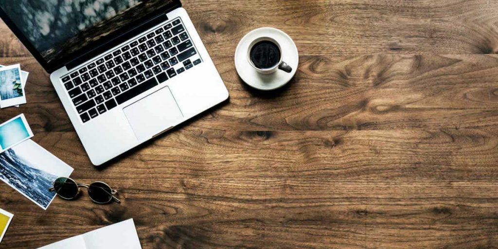 Desk with Laptop and Cup of Coffee